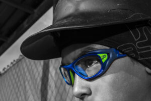 Guy wearing Helmet Spex electric blue, black and white sports goggles with helmet