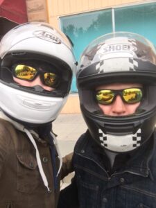 Two VCA (Veterans Charity Ride) riders wearing helmets.