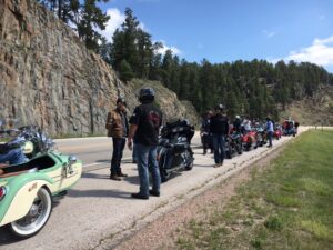 VCR (Veterans Charity Ride) group lines up to take break along roadside.